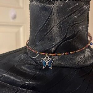 Colorful Beaded Necklace with Blue Butterfly Pendant